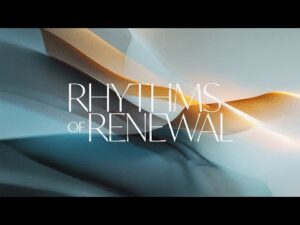 Abstract waves in blue and gold hues with the text "Rhythms of Renewal" in large white letters across the center.